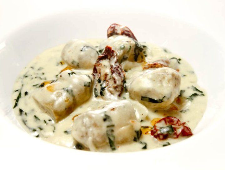 Alcachofas en salsa de queso y espinaca