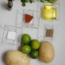 Ingredientes para receta 4 piezas de papa blanca 4 piezas de limón 1 cucharita de paprika 1/2 manojo de cilantro sal al gusto pimienta negra molida al gusto aceite de oliva al gusto desinfectante de verduras al gusto